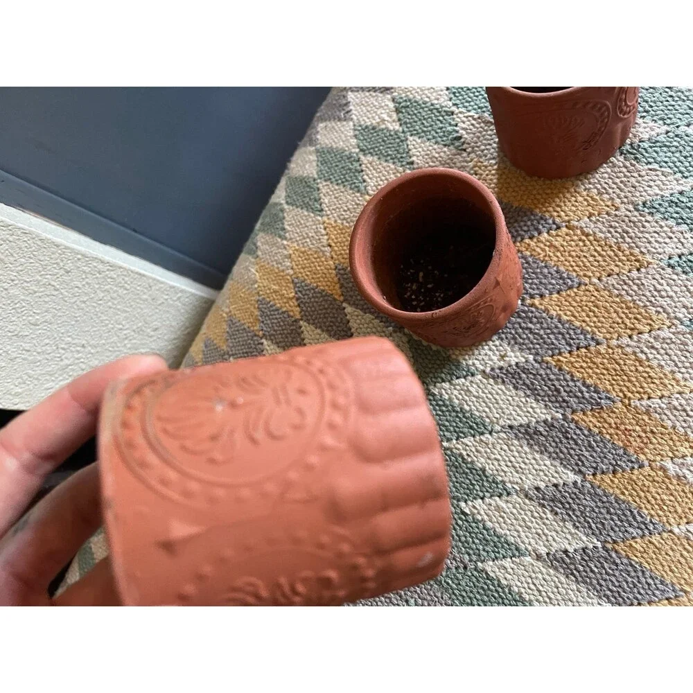 Painted small terra cotta style planters set of 4